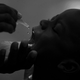 In this 2009 Associated Press file photo, a child in Haiti receives a vaccination in the form of oral droplets.